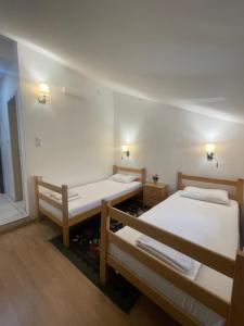 a room with two bunk beds and a window at Apartments & Rooms L E F T RIVER Belgrade in Belgrade
