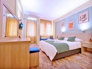 Postel nebo postele na pokoji v ubytování Native Hotel