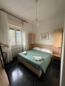 Llit o llits en una habitació de Hotel La Pineta