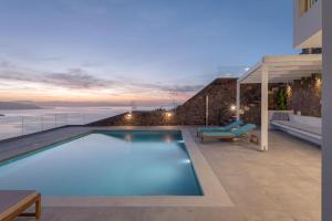 a swimming pool on the roof of a house at Kaerati Villa Aegina in Aegina Town +65 photos