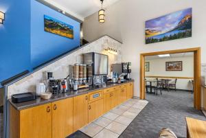 a kitchen with a counter with a coffee maker at Days Inn by Wyndham Great Falls in Great Falls