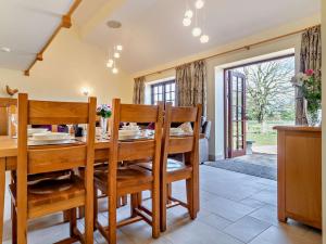 a dining room with a table and chairs at 3 Bed in Repps with Bastwick 94054 in Potter Heigham