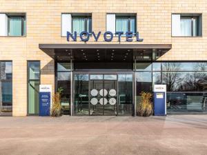 a new object sign on the front of a building at Novotel Hamburg City Alster in Hamburg