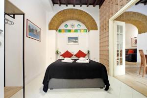 Giường trong phòng chung tại 4BNB - Lungaretta Jacuzzi Apartment