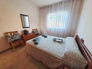 Postel nebo postele na pokoji v ubytování Apartamento en la playa de Les Cases de Alcanar + 29 fotografií