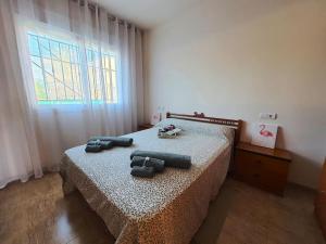 Ένα ή περισσότερα κρεβάτια σε δωμάτιο στο Apartamento en la playa de Les Cases de Alcanar +70 φωτογραφίες