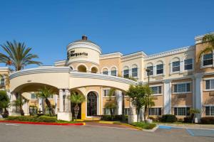 a large building with a dome on top of it at Hotel Marguerite South Anaheim - Garden Grove, Trademark Collection by Wyndham in Anaheim