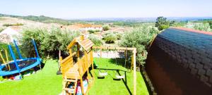 an aerial view of a playground with a slide at Lagarto Pintado Casa n'Aldeia in Castelo Novo