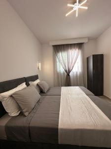 מיטה או מיטות בחדר ב-Stegna Sea & Sun