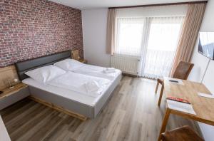 Voodi või voodid majutusasutuse Hotel-Restaurant Zum Schwalbennest toas