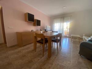A television and/or entertainment centre at Delfines II Solo Familias Serviplaya
