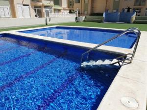 The swimming pool at or close to Delfines III Solo Familias Serviplaya