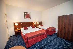 Letto o letti in una camera di Hotel Grand