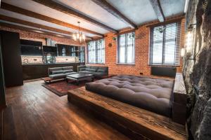 a large living room with a large couch in the middle at Św. Antoniego in Wrocław +2 photos