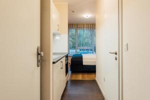 Postel nebo postele na pokoji v ubytování MYKY Aparthotel Harburg - Free Parking