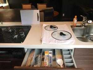 a kitchen counter with a sink and a stove at Tokurajyo - Vacation STAY 15813 in Akiruno