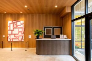 an office with a reception counter with a potted plant at SAKIA stay in Awaji