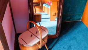 a suitcase sitting in front of a mirror at BirnenhofArts in Bad Rodach