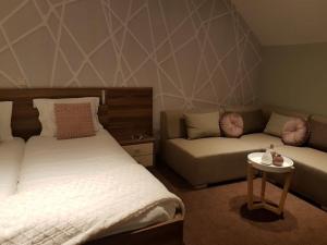 Ένα ή περισσότερα κρεβάτια σε δωμάτιο στο De Eenhoorn