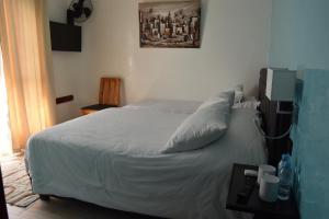 Postel nebo postele na pokoji v ubytování Hotel L'Initiale