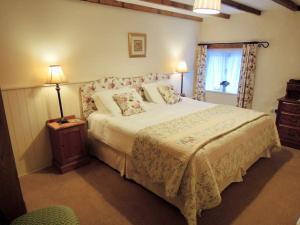 Voodi või voodid majutusasutuse The Cider Barn toas