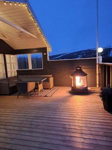 a patio with a fire pit on a house at Dimond cottage in Laxamýri
