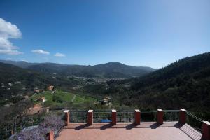 a balcony with a view of a mountain at 259 - La casetta di Dany, nel verde di Casarza a 15 minuti dal mare in Casarza Ligure