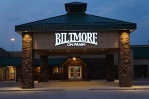 a building with a sign that reads bilmore on main at The Biltmore Hotel & Suites Main Avenue in Fargo