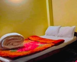 Postel nebo postele na pokoji v ubytování HOTEL PURNI DARJEELING