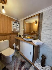 a bathroom with a toilet and a sink at Diamona Lux Spa Apartman in Niš +17 photos