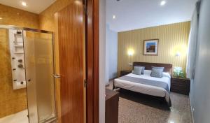 Posteľ alebo postele v izbe v ubytovaní Hotel Arcos Catedral
