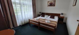 Letto o letti in una camera di Hotel Grand