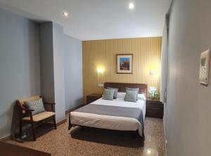 Posteľ alebo postele v izbe v ubytovaní Hotel Arcos Catedral