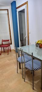 a table and chairs with a bowl of bananas on it at Twin Room in shared Apartment in Cee