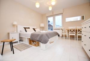 Posteľ alebo postele v izbe v ubytovaní Apartamenty NAVIGATOR-PORT