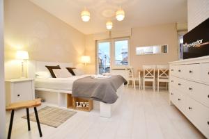 Posteľ alebo postele v izbe v ubytovaní Apartamenty NAVIGATOR-PORT