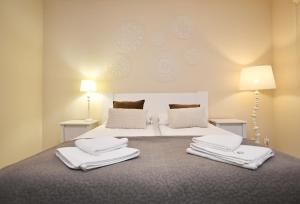 Posteľ alebo postele v izbe v ubytovaní Apartamenty NAVIGATOR-PORT