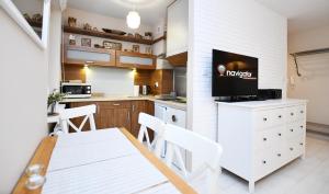 Kuchyňa alebo kuchynka v ubytovaní Apartamenty NAVIGATOR-PORT