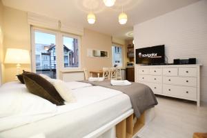 Posteľ alebo postele v izbe v ubytovaní Apartamenty NAVIGATOR-PORT