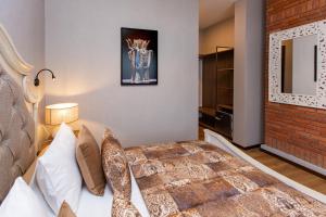 Voodi või voodid majutusasutuse Seventeen Rooms toas