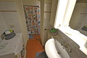 a bathroom with a sink and a toilet and a shower at Casa Franci in Cortona