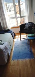 a bedroom with a bed and a rug and a window at Twin Room in shared Apartment in Cee