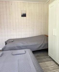 Postel nebo postele na pokoji v ubytování Palūšės Kempingas (nameliai)