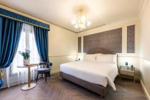 Postel nebo postele na pokoji v ubytování Hotel Palazzina Sardi