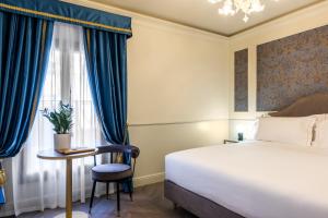 Postel nebo postele na pokoji v ubytování Hotel Palazzina Sardi