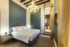Postel nebo postele na pokoji v ubytování Hotel Palazzina Sardi