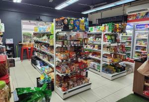 a grocery store aisle with shelves of food at Manila Condo Luneta LRT UN Taft Ave Wi-Fi Netflix in Manila