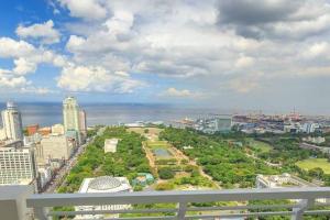 a view of the city from the balcony of a building at Manila Condo Luneta LRT UN Taft Ave Wi-Fi Netflix in Manila