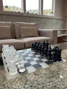 a chess board on a table in a living room at Platina Luxe House in Toyama
