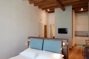 Televízia a/alebo spoločenská miestnosť v ubytovaní B&B Suite Home Trani